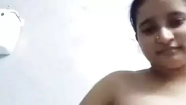 Bengali girl in bathroom strips dresses and nude show